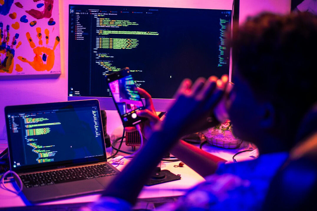kids coding on laptop