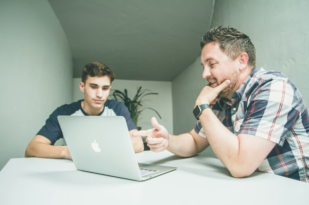 coding mentor helping student