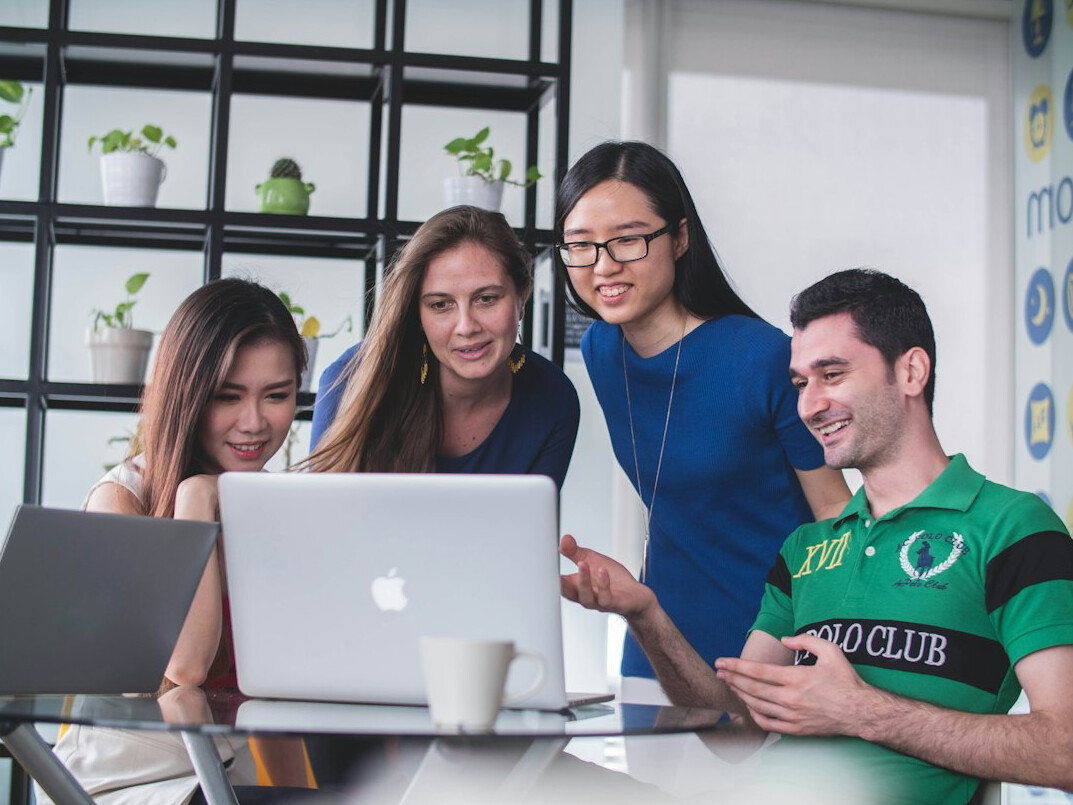 group of students discussing code